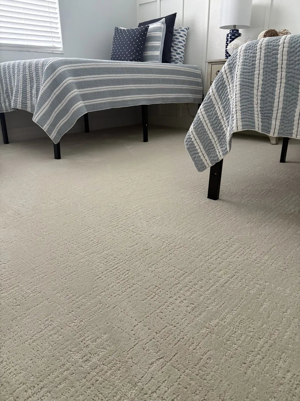 Textured neutral carpet installed in a Naples bedroom