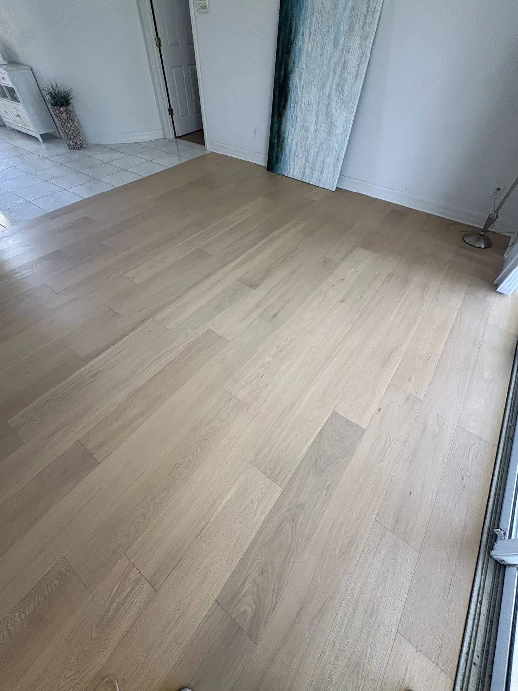 Light oak-look plank flooring in a bright Naples living area