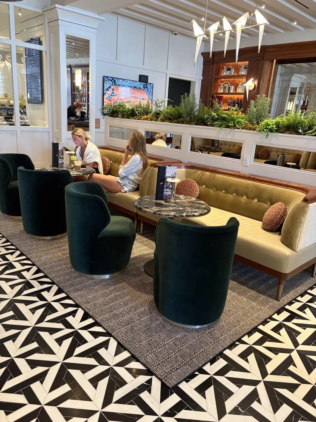Custom bordered area rug in a Naples clubhouse lounge by Enterprise Floors