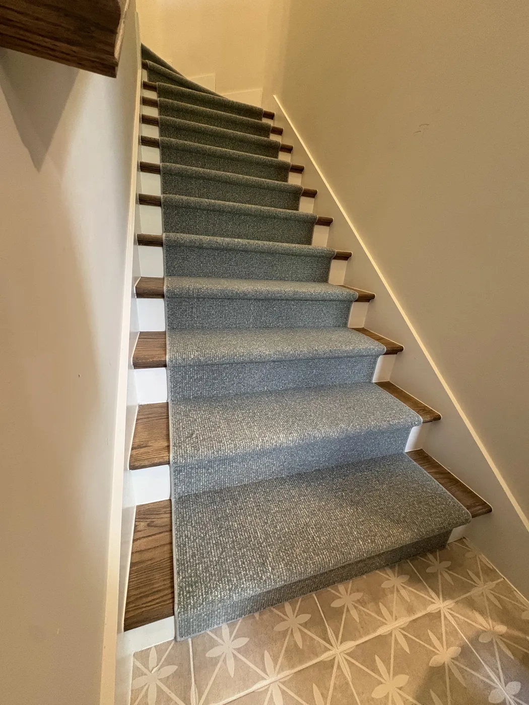 Blue-grey stair runner over wood treads installed in Naples